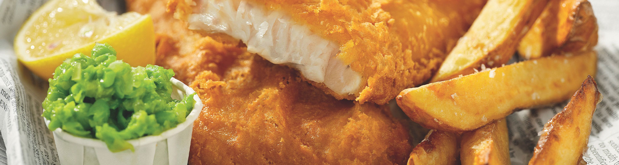 Fish & Crisp med ugnsgrillad potatis och smöriga ärter